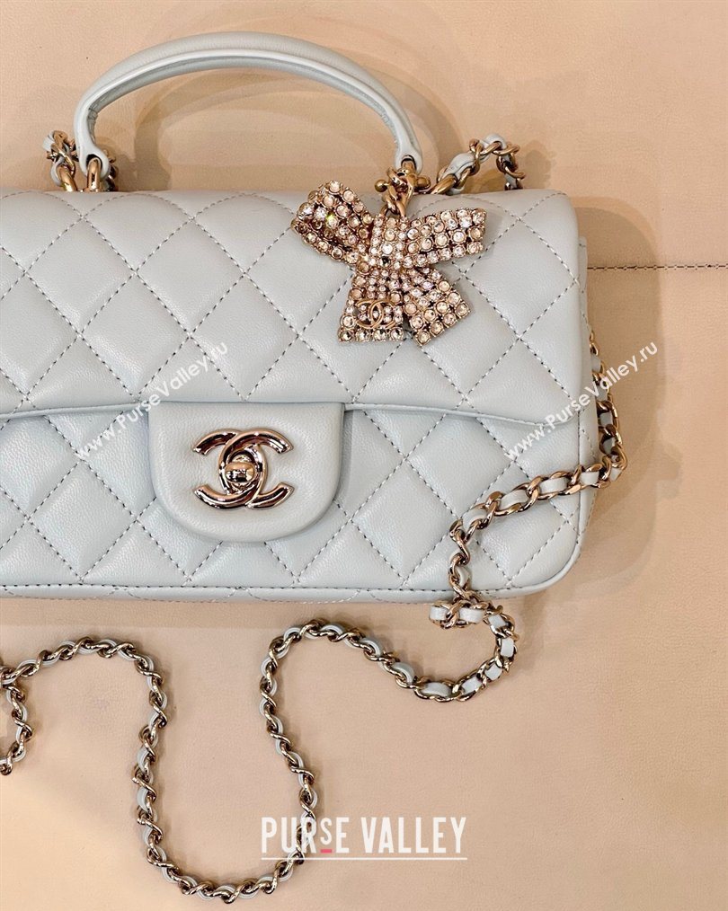 Chanel Lambskin Leather Mini Classic Flap Handbag With Top Handle and Bow Charm Light Blue 2026 AS2431 (yezi-260204042)